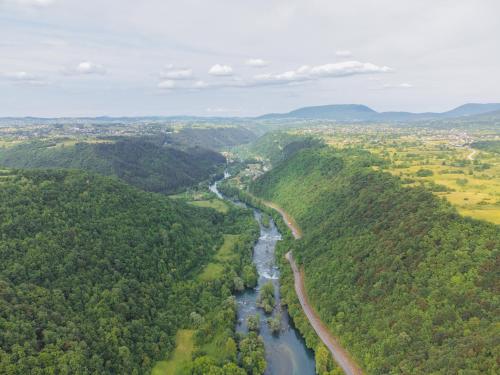 an aerial view of a river in a valley at UnaSoul in Bihać