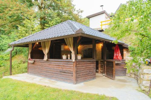 a large wooden gazebo with a roof at UnaSoul in Bihać