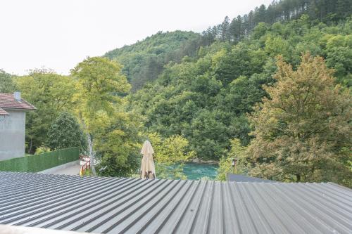 a closed umbrella sitting on top of a roof at UnaSoul in Bihać