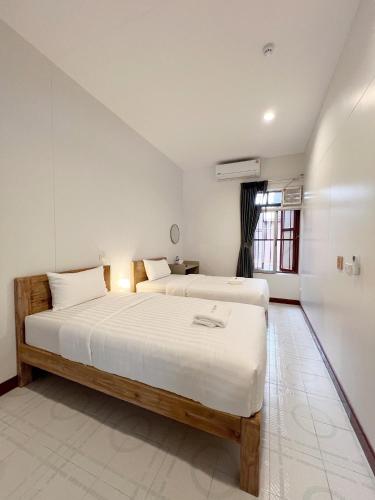 Ένα ή περισσότερα κρεβάτια σε δωμάτιο στο Au samlor guesthouse