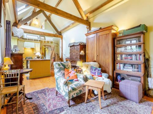 a living room with a couch and a table at Little Tarbet in Dornoch