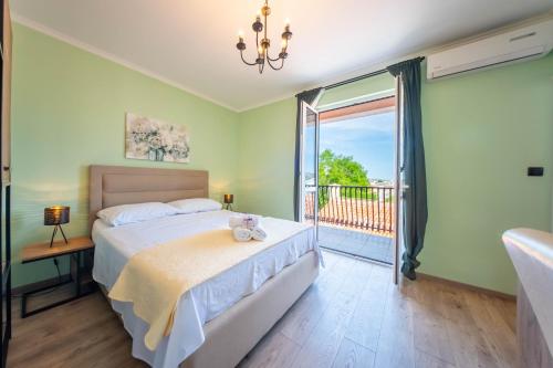 Postel nebo postele na pokoji v ubytování Rooms Villa Padre