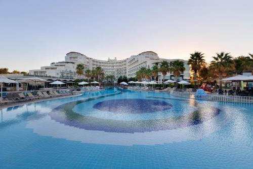 a large swimming pool in front of a resort at Sealight Resort Hotel in Kusadası