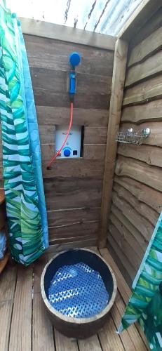 aoutside view of a bird house with a tub at Bridgewood Camping - CABIN in Sherborne