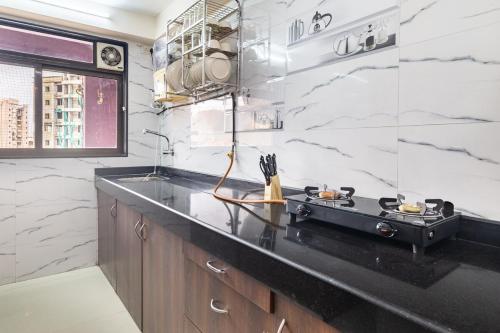 Kuchyň nebo kuchyňský kout v ubytování Treat Homes Service Apartment in BKC Sindhuratna 701