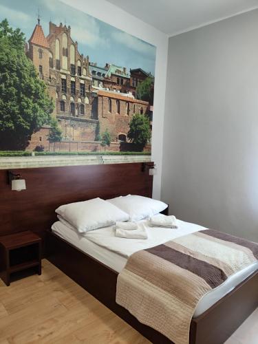 Postel nebo postele na pokoji v ubytování Hotelik w Centrum