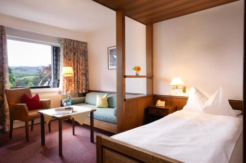 Postel nebo postele na pokoji v ubytování Romantik Hotel Störmann