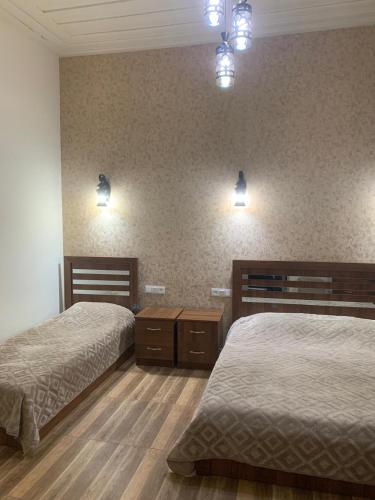 Voodi või voodid majutusasutuse Tuff House toas