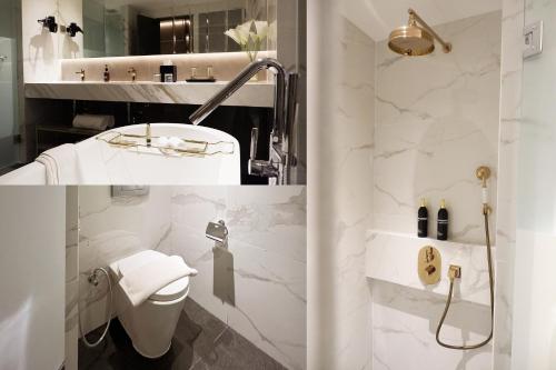 Un baño de HARRIS Hotel & Conventions Gubeng