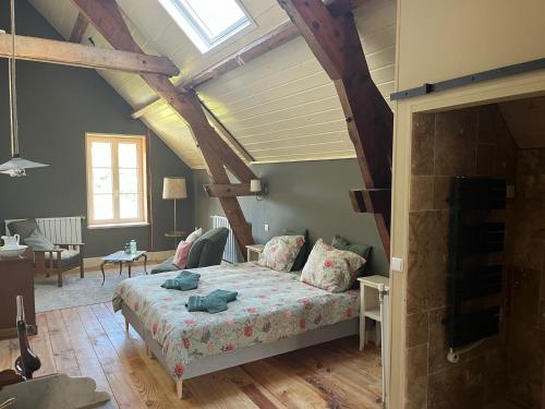 Postel nebo postele na pokoji v ubytování Moulin de Maupoy