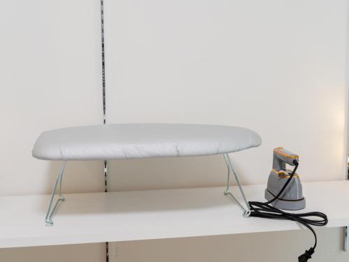 a white bed sitting on top of a shelf at Ikebukuro 10min walk, Shinjuku 10min, Switch, Free Wi-Fi ,PocketWi-Fi in Tokyo