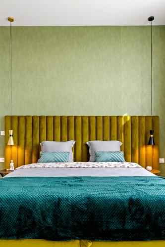Ένα ή περισσότερα κρεβάτια σε δωμάτιο στο Rin Luxury Apartments