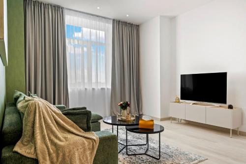 Μια τηλεόραση ή/και κέντρο ψυχαγωγίας στο Rin Luxury Apartments