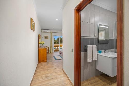 a bathroom with a sink and a mirror at Villa Monte Velho in Albufeira