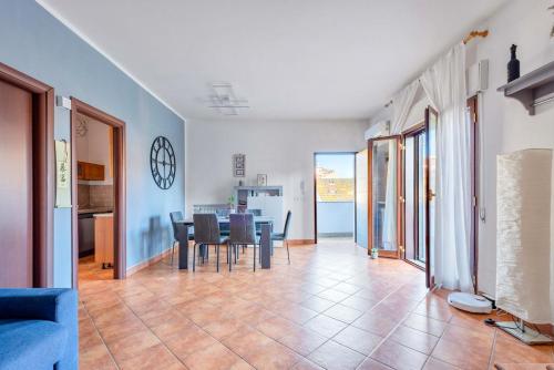 a living room and dining room with a table and chairs at Pinohaus in Ladispoli