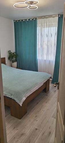 Postel nebo postele na pokoji v ubytování NGR Residence