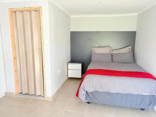Ένα ή περισσότερα κρεβάτια σε δωμάτιο στο homeaway at 66