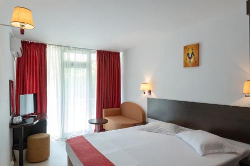 Postel nebo postele na pokoji v ubytování Hotel Recif
