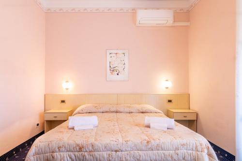 Postel nebo postele na pokoji v ubytování Hotel Marnie