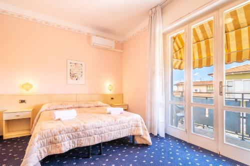 Postel nebo postele na pokoji v ubytování Hotel Marnie