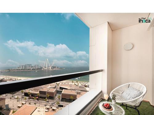a balcony with a view of the ocean at Boho Studio Beachfront Ain Sea View JBR Walk 1min in Dubai