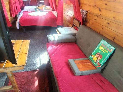 an overhead view of a room with two beds and a couch at No frills narrowboat stay over experience in Lincoln