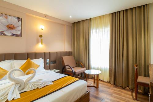 Postel nebo postele na pokoji v ubytování Senora Suites