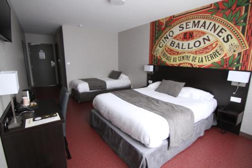 a hotel room with two beds and a sign on the wall at Logis Hôtel - La Chambre d'Amiens in Amiens