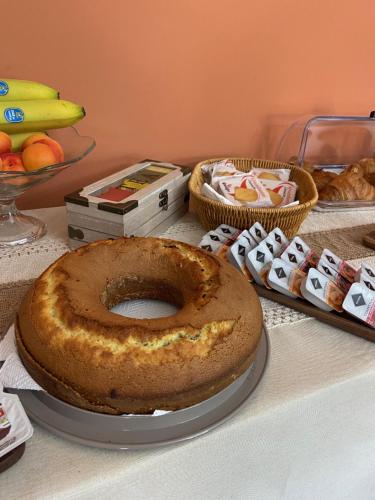 a large bagel sitting on top of a table at Villa Rita Guest House Torvaianica in Torvaianica