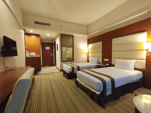 Postel nebo postele na pokoji v ubytování Pearl View Hotel Prai, Penang