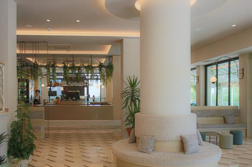 a lobby with a column in the middle of a building at Clipper in Pesaro