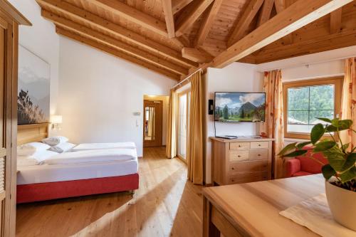 A bed or beds in a room at Alpenvital Tirol Appartements