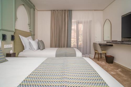 Giường trong phòng chung tại Amanar Hôtel & Spa Ouarzazate
