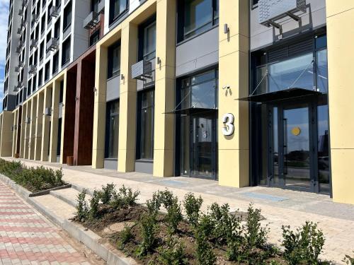 a building with the number on the side of it at Уютная квартира 5 минут от Барыс арены in Astana