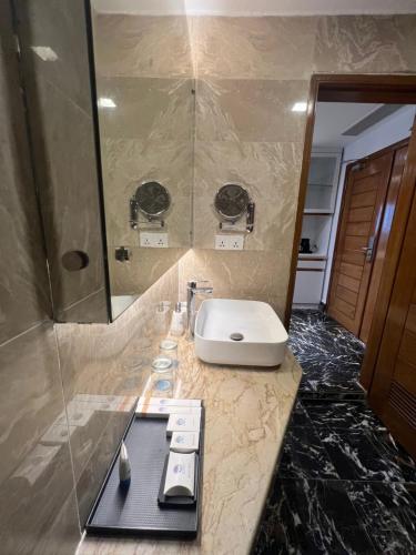 a bathroom with a sink and a shower at Jol Torongo in Cox's Bazar