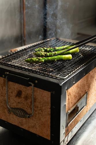 a grill with four asparagus on top of it at Knockinaam Lodge in Portpatrick