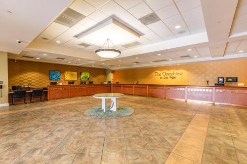 a large waiting room with a table in the middle at The Grandview at Las Vegas in Las Vegas