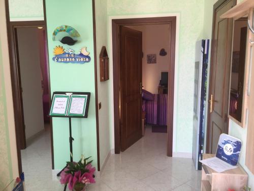 a hallway with a door leading to a room at L'Aurora Viola in Carbonia
