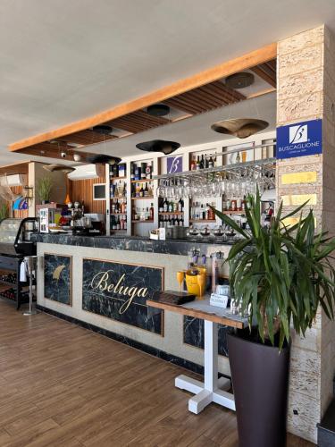 a bar in a restaurant with a counter and a bar sidx sidx at La Vista by Ronda in Eforie Sud