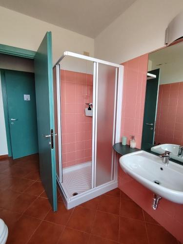 a bathroom with a shower and a sink at Agriturismo Fiorbello in Montirone