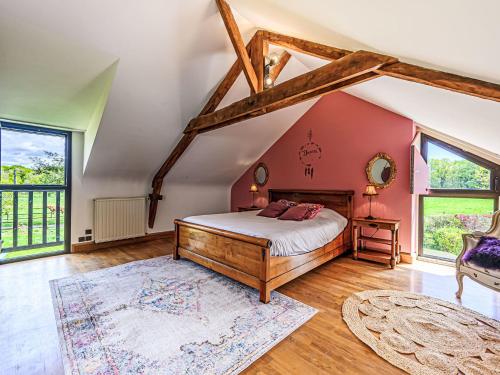 a bedroom with a bed in a attic at Holiday Home Karvez by Interhome in Ploeren