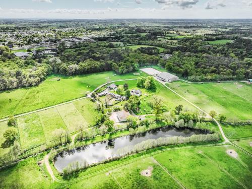 an aerial view of an estate with a pond at Holiday Home Karvez by Interhome in Ploeren