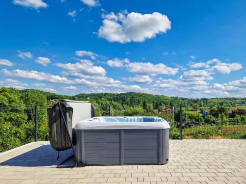 a hot tub sitting on top of a patio at Holiday Home Golub by Interhome in Duga Resa