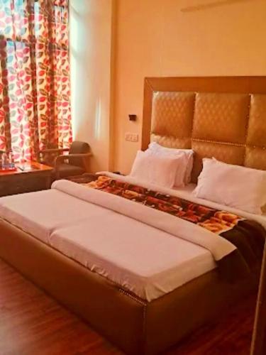 Katil atau katil-katil dalam bilik di Hotel Press Pure veg