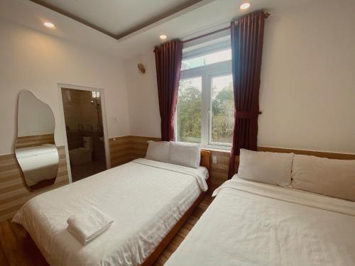 Postel nebo postele na pokoji v ubytování Hoa Chuông Villa Đà Lạt