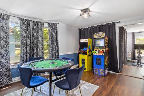 a games room with a table and a game console at Walk to Ithaca Commons Bars Shops Trails and Close to Cornell in Ithaca