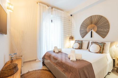 a bedroom with a large bed with a large window at Dimora Tesoro - by Cala Salento in Torre Lapillo