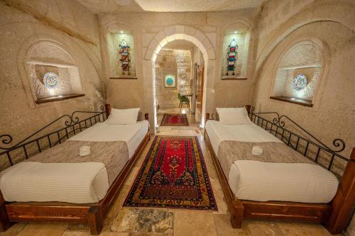 Letto o letti in una camera di Osmanbey Cave House