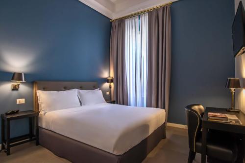 Postel nebo postele na pokoji v ubytování Boutique Hotel Metro 900
