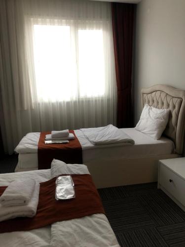 Ένα ή περισσότερα κρεβάτια σε δωμάτιο στο Vira Suite Otel
